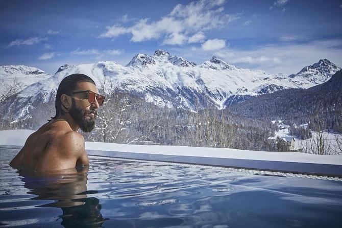 The Swiss Alps are synonymous with celebrity travel. With snow-clad mountains and natural beauty, this is quite a hot spot for a vacation.
In pic: One of Bollywood's most loved heroes, Ranveer Singh shared a picture of him in a pool with an absolutely breath-taking view of the Alps in the background. This is also where Ranveer Singh tied the knot with his lady-love Deepika Padukone. Pic/Ranveer Singh's Instagram